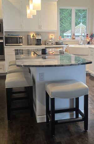 Style Upholstering's 680 Black Wood Backless Bar Stools with White Seat Cushion in Customer's White and Black Modern Kitchen