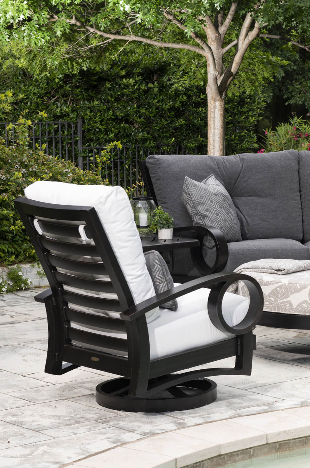 Mallin's Eclipse Outdoor Swivel Rocking Chair Outside on the Patio