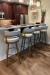 Amisco's Ronny Modern Gold Swivel Bar Stools with Low Back in Customer's White and Brown Kitchen