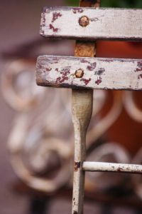 Remove rust spots on wrought iron furniture