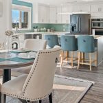 Mixing and matching bar stools and chairs in an open-concept kitchen
