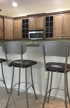Amisco's Bean Swivel Bar Stools with Seat Cushion and Back - in Transitional Brown Kitchen with Stainless Steel Appliances