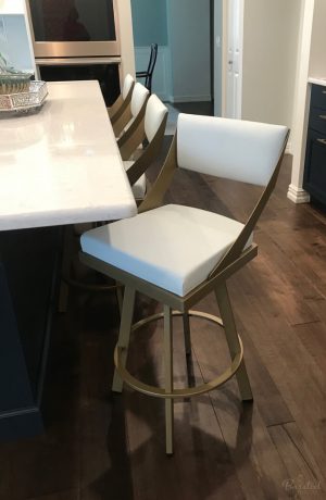 Amisco's Fame Modern Gold Swivel Counter Stools with Off-White Upholstery in Modern Kitchen