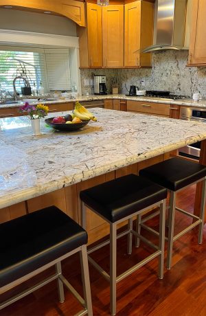 Amisco's Bradley Taupe Backless Bar Stools in Black Vinyl in Customers Kitchen