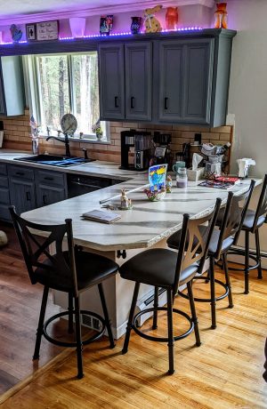 Trica's Aramis Black Swivel Bar Stool with X Back in Customer's Transitional Kitchen