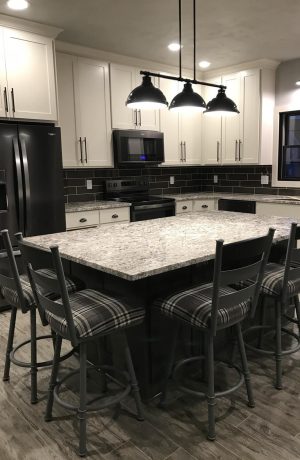 Trica's Louis Swivel Black Metal Counter Stools with Plaid Fabric in Transitional Modern Black and White Kitchen