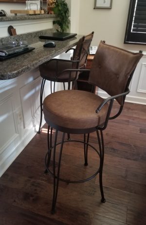 Trica's Bill Transitional Brown Swivel Bar Stool with Arms and Button-Tufting in Home Office