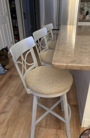 Wesley Allen's Sausalito Silver Swivel Bar Stools with Tan Fabric in Modern Kitchen