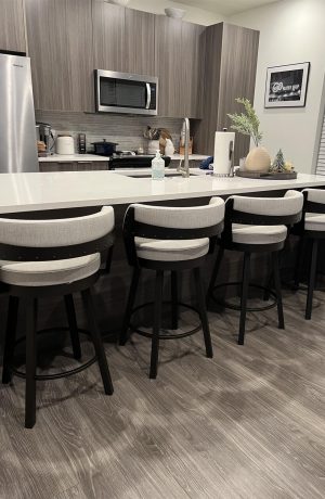 Amisco's Russell Modern Swivel Bar Stools with Low Back in Customer's Modern Kitchen