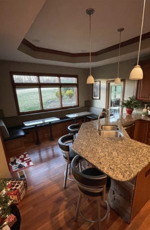 Amisco's Ronny Swivel Bar Stools with Low Back in Transitional Open Concept Kitchen