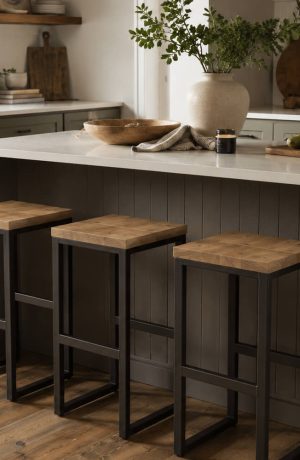 Modern black backless bar stools with wood seat in transitional kitchen