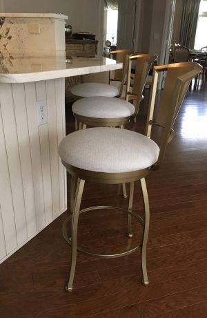 Wesley Allen's Berkeley Modern Gold Swivel Bar Stool with Curved Back in Customer Kitchen
