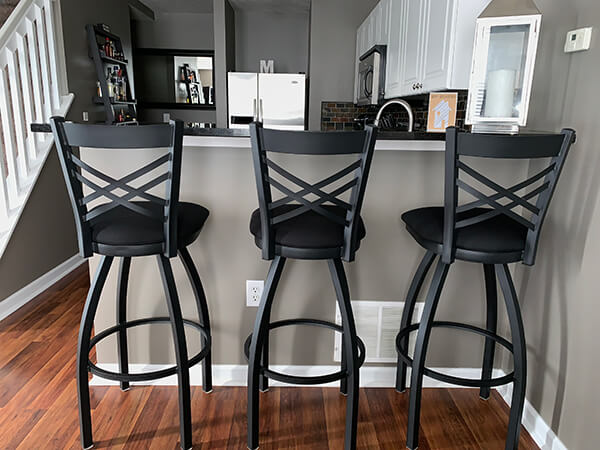 Holland's Catalina Swivel Extra Tall Stools with Cross Back Design in All Black - Shown in Modern Kitchen