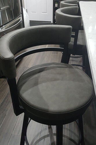 Amisco's Ronny Swivel Barstools with Curved Back in Customer's Modern Kitchen