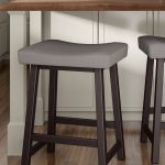 Amisco's Miller Saddle Backless Bar Stool with Sloped Seat, Four Legs and Metal Frame