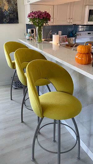 Trica's Biscotti Swivel Kitchen Counter Stool in Yellow Upholstery and Gray Base Metal Finish
