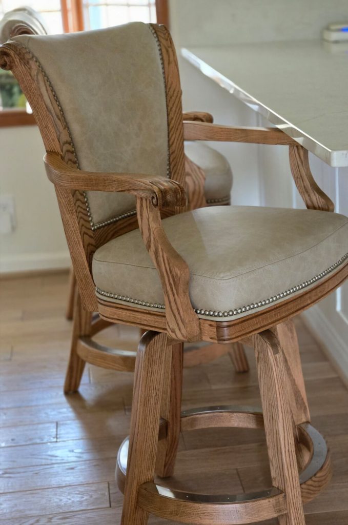 Darafeev's Classic Honey Oak Swivel Bar Stool in Leather and Nailhead Trim - In Kitchen
