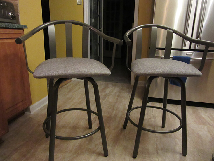 Amisco's Gatlin Modern Swivel Counter Stools with Arms in Gray Metal Finish