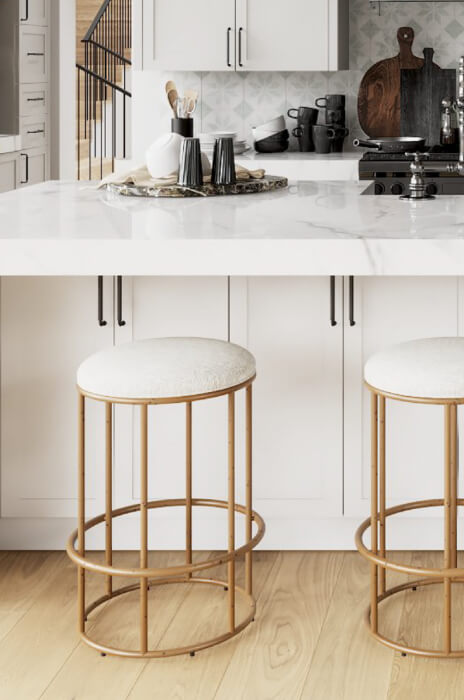 Wesley Allen's Nyx Modern Backless Gold Bar Stools in Modern White Kitchen