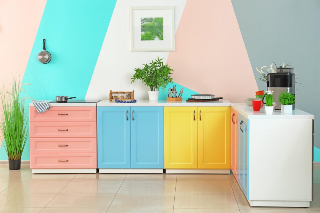 Kitchen cabinets that are multi-colored help create a Maximalist design