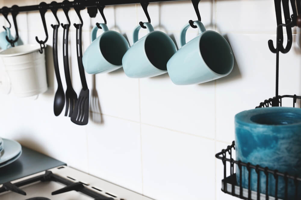 Colorful mugs in kitchen