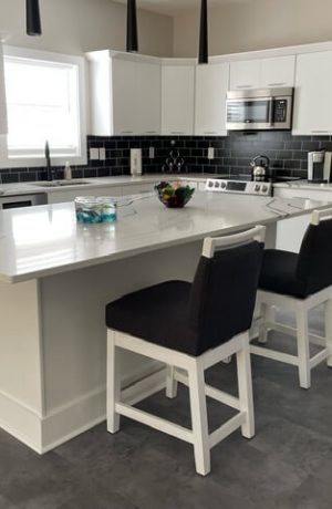 Style Upholstering's 6622-SSB White Wood Bar Stools with Black Fabric in Modern Kitchen