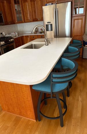 Holland's Artemis Black Swivel Bar Stools in Teal Blue in Customer's Kitchen
