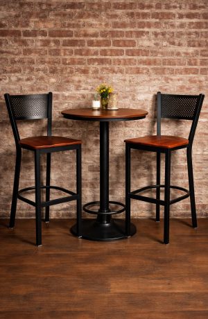 Trendler's Black Metal Bar Stool with Mesh Back and Wood Seat in Industrial Restaurant