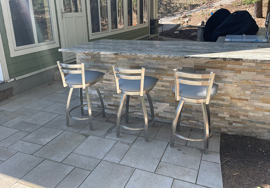 Jackie's stainless steel outdoor swivel bar stools in customer's outdoor kitchen