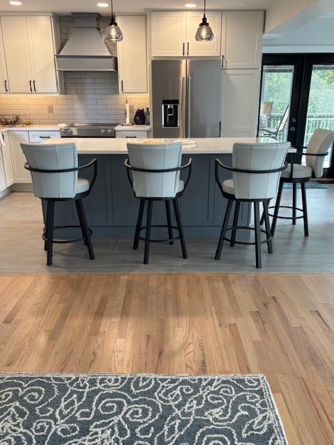 Amisco's Cardin Black and Blue Modern Swivel Counter Stools in Customer's Kitchen