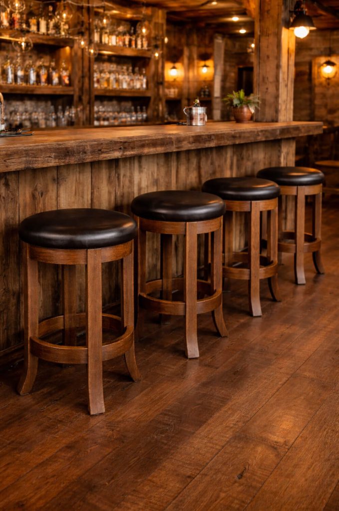Simply Amish's Belmont Backless Solid Wood Barstool in Restaurant Bar