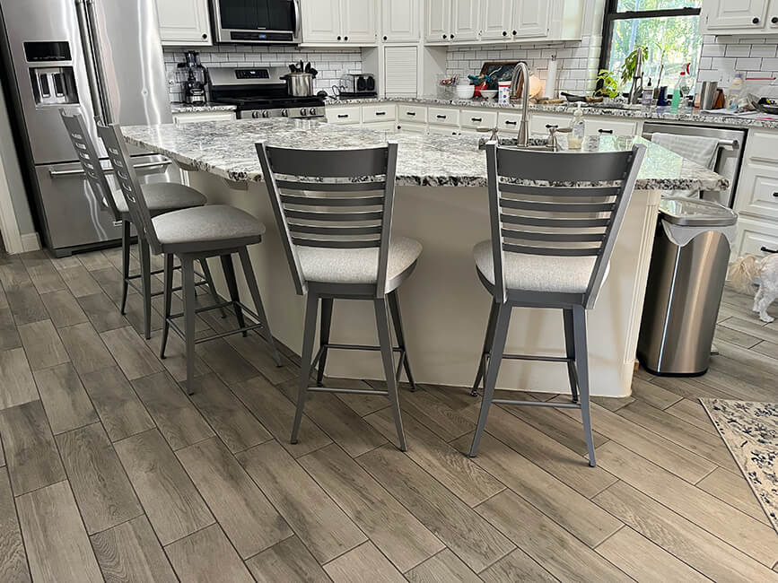 Amisco's Edwin Silver/Gray Swivel Bar Stools with Backs in Customer's White Kitchen