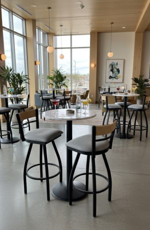 Holland's 881 Revelle Low Back Bar Stools in Black Metal and Natural Wood Back - Shown in Restaurant