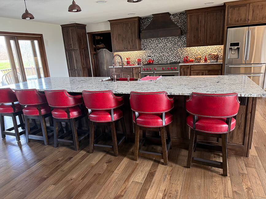 Style Upholstering's 141 Red Leather Swivel Bar Stools in Customer's Kitchen - Front Side