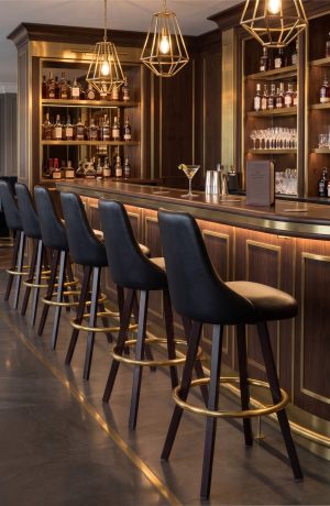 Black Upholstered Bar Stools with Gold Footrest - Commercial Bar - Legacy