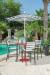 Woodard's Palm Coast Barstools Outside Near Pool with Pub Table