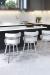 Wesley Allen's Miramar Brushed Stainless Swivel Barstools with Low Back in Black and White Kitchen
