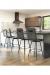 Amisco's Bray Upholstered Swivel Bar Stools in Modern Kitchen with Waterfall Counter and Gray/White Colors