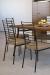 Amisco's Lisia Industrial Dining Chairs with Tall, Slat Back in Brown and Shown in Modern Dining Room with Wood Table