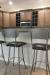 Amisco's Bean Swivel Bar Stools with Seat Cushion and Back - in Transitional Brown Kitchen with Stainless Steel Appliances
