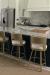 Amisco's Brock Gold Swivel Counter Stools in Customer's Modern Kitchen