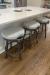 Amisco's Bryce Gray Silver Backless Swivel Bar Stools in Customer's Kitchen
